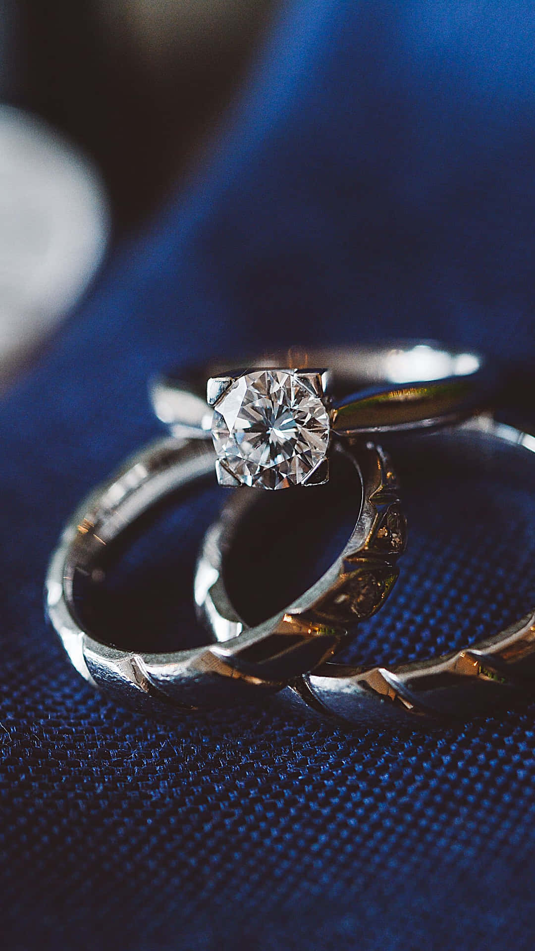 Wedding Ring On Blue Cloth Background