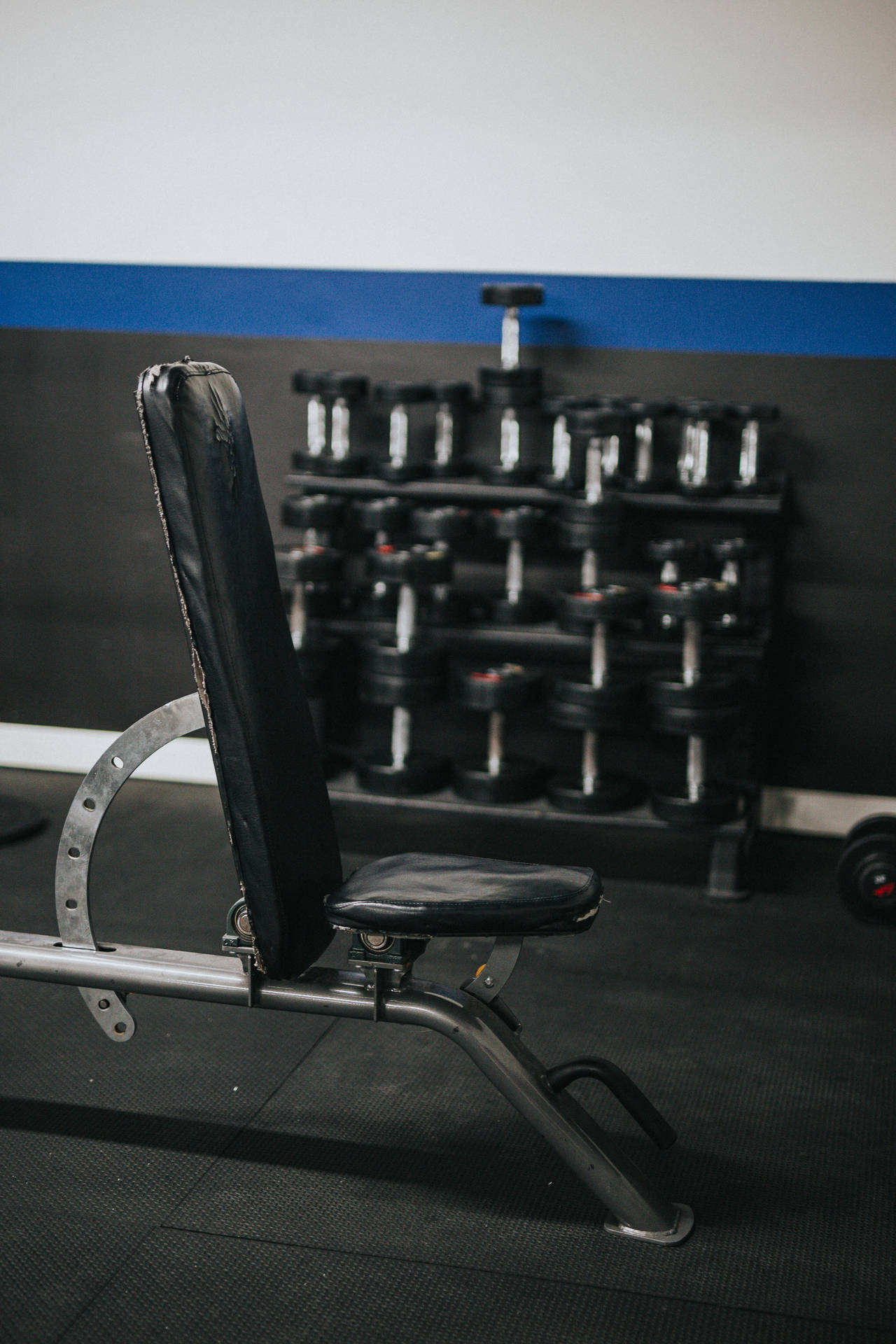 Weightlifting Equipment In Gym Background