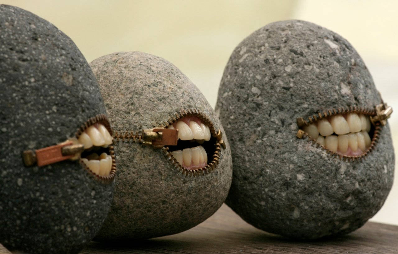 Weird Stones With Mouth Background