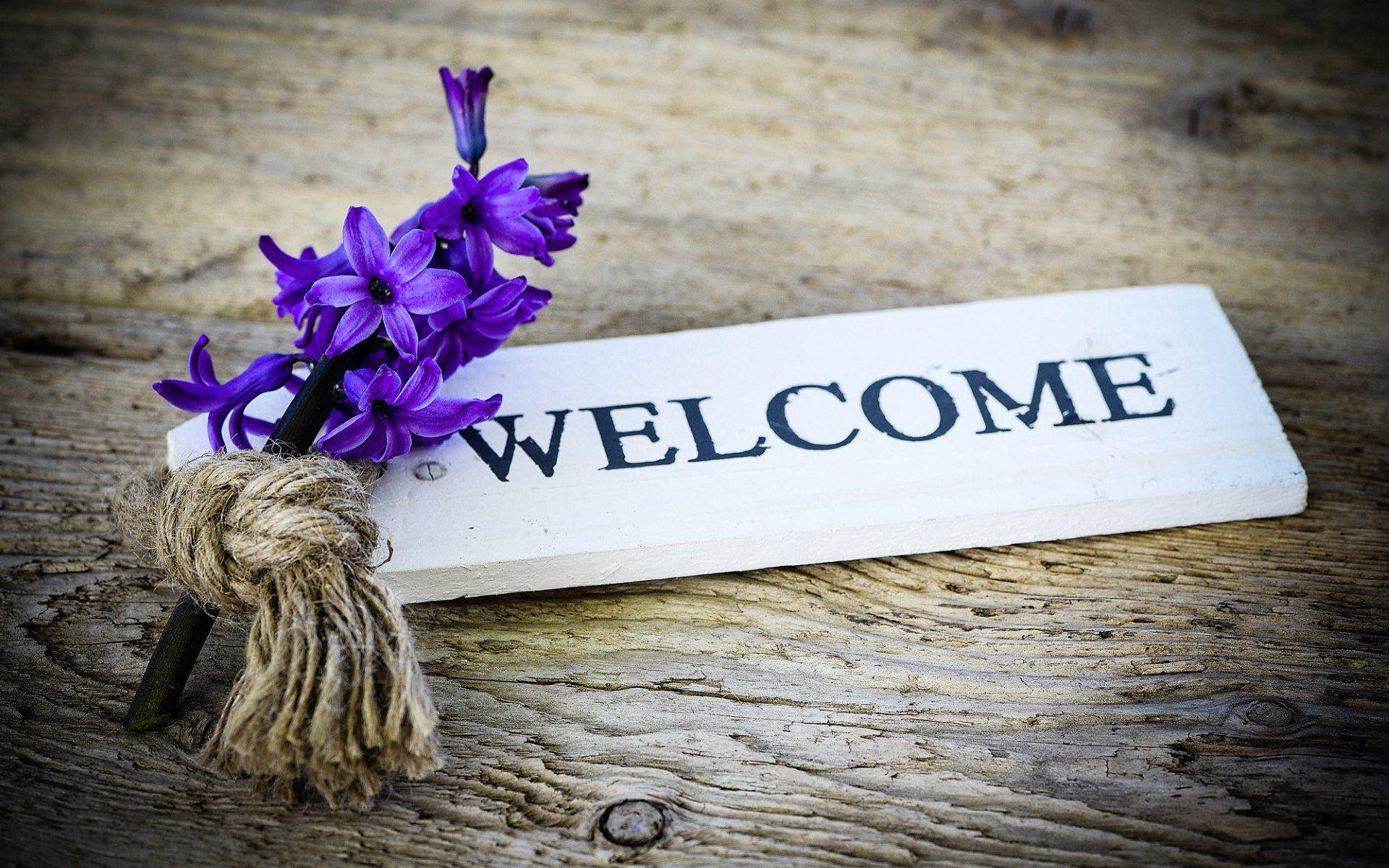 Welcome Decor With Purple Flowers Background