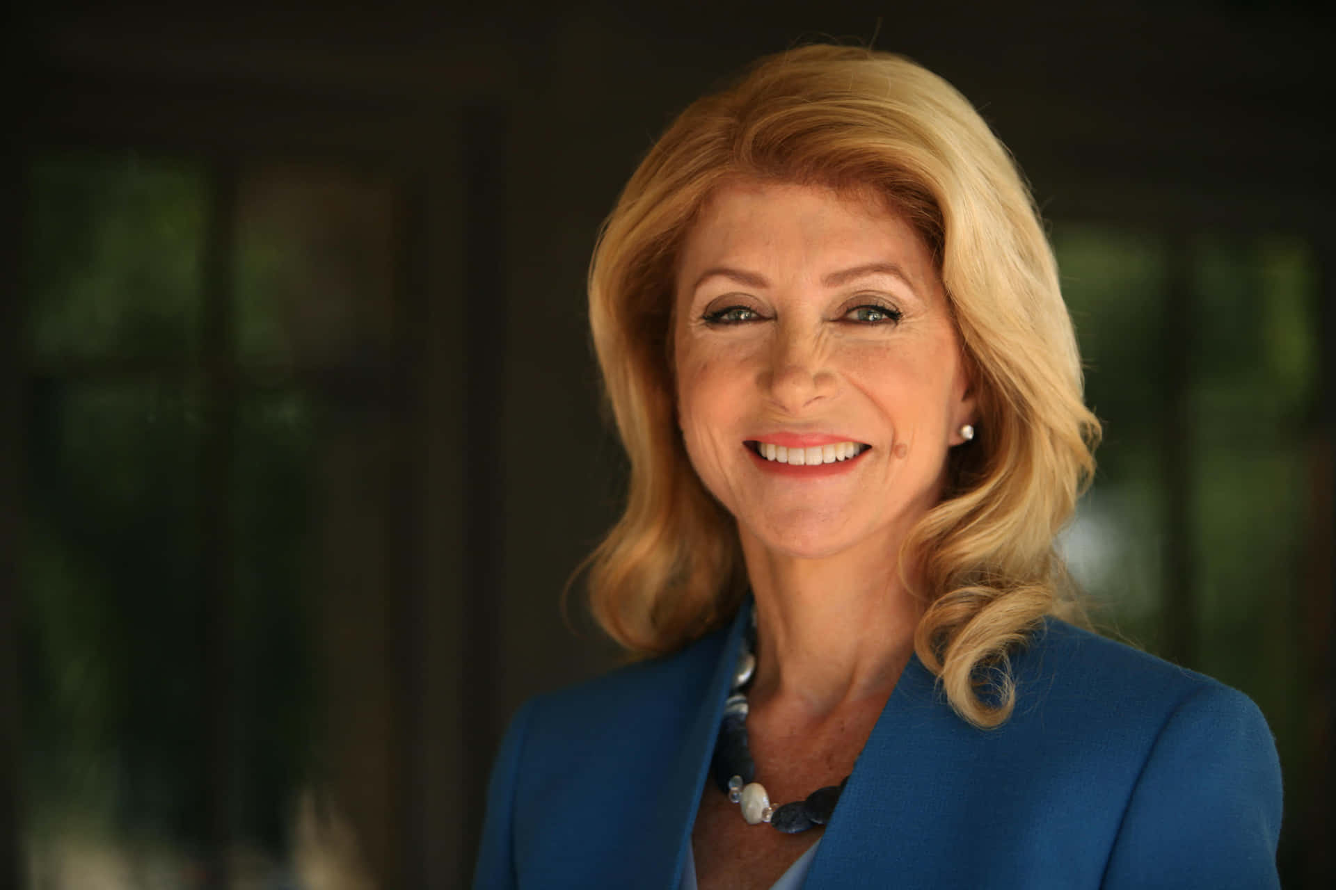 Wendy Davis Wears A Blue Suit Background