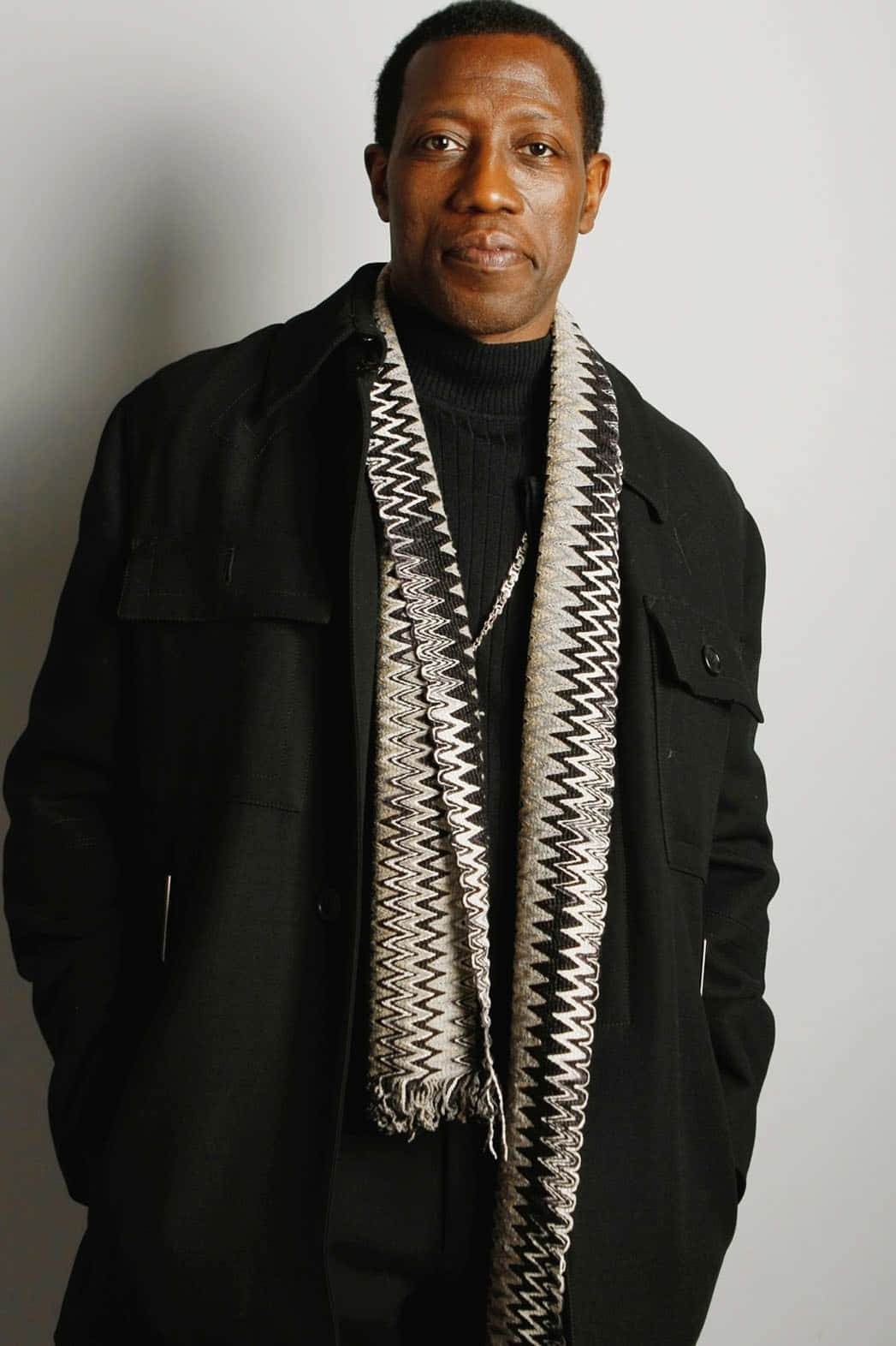 Wesley Snipes Exuding Confidence In A Stylish Photoshoot Background
