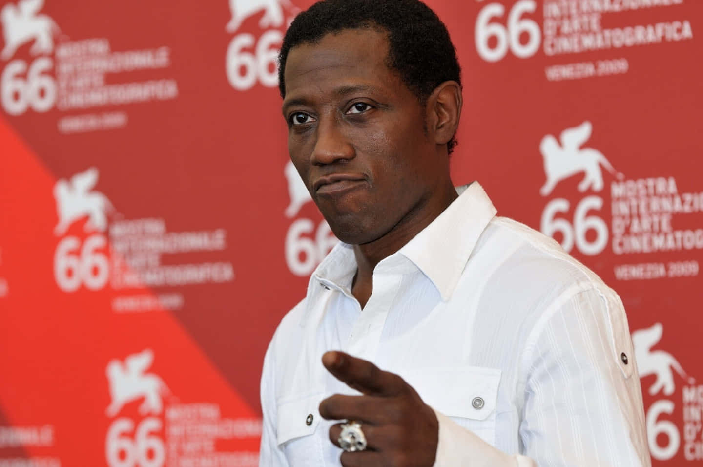 Wesley Snipes Looking Charismatic In A Black Suit And Sunglasses Background