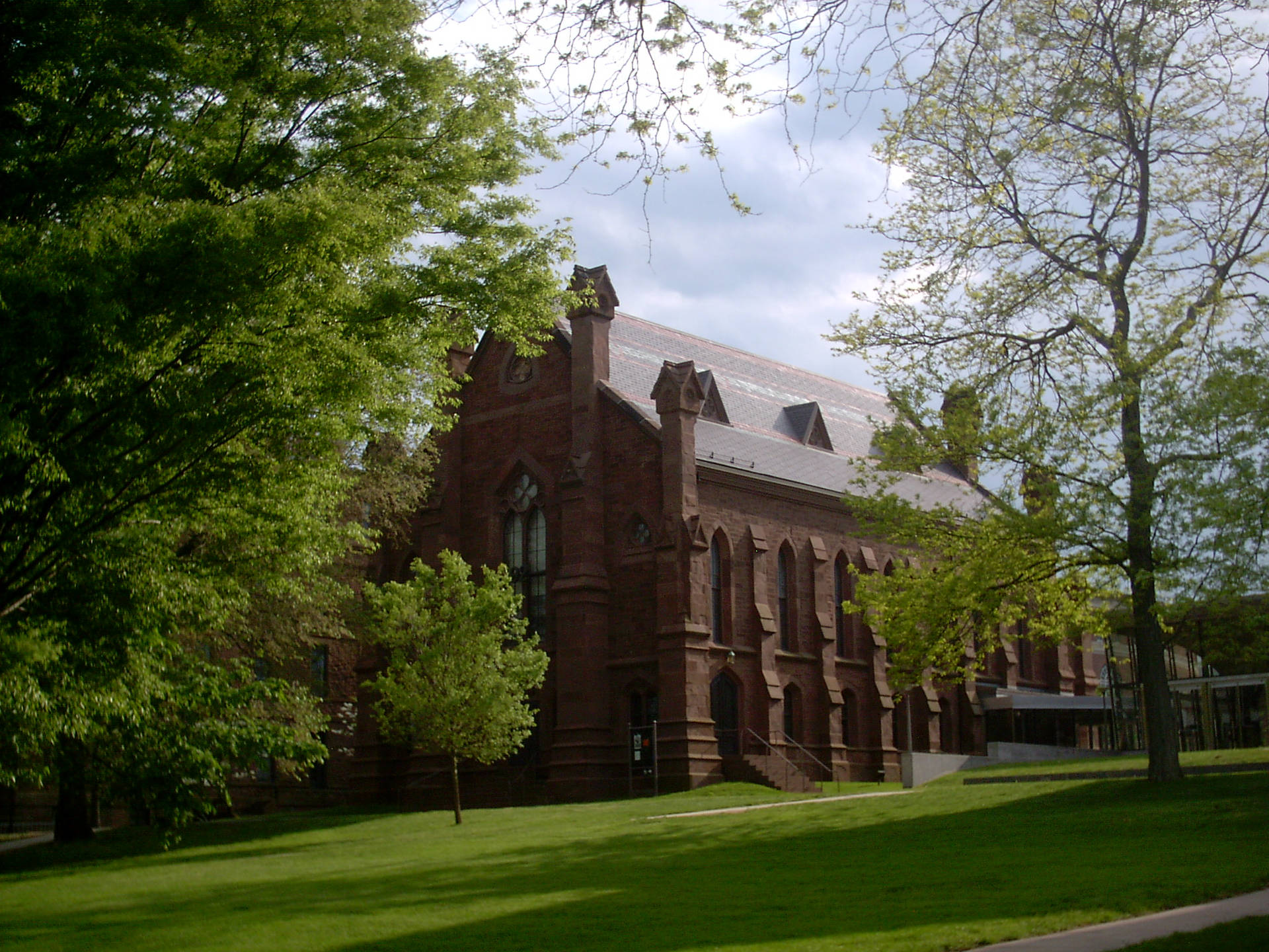 Wesleyan University Building With Trees Background