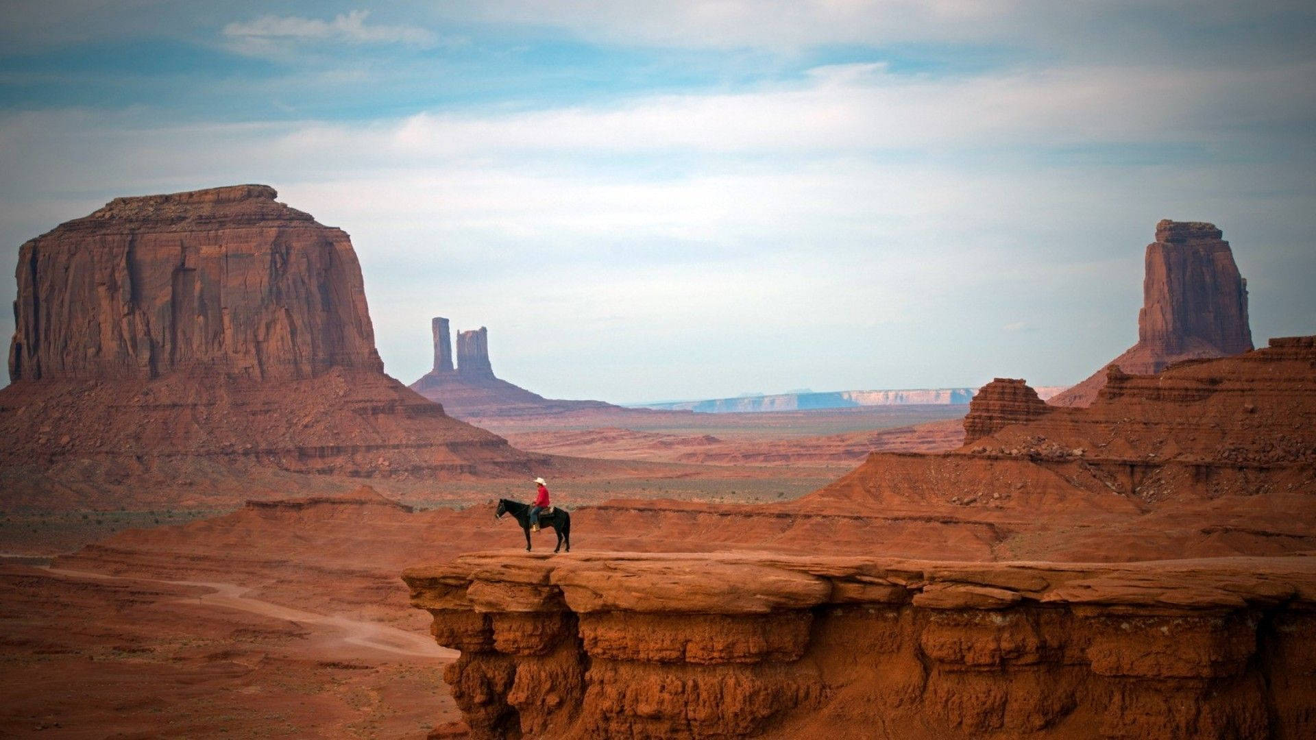 Western Cowboy On A Cliff Background
