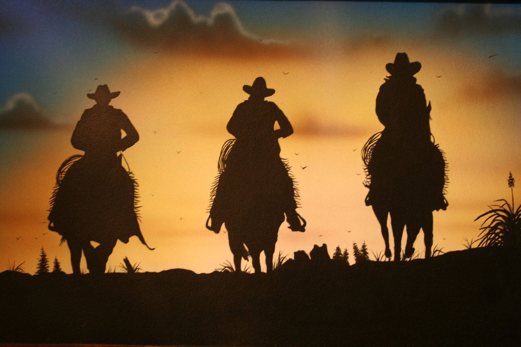 Western Cowboys Riding Sunset Background