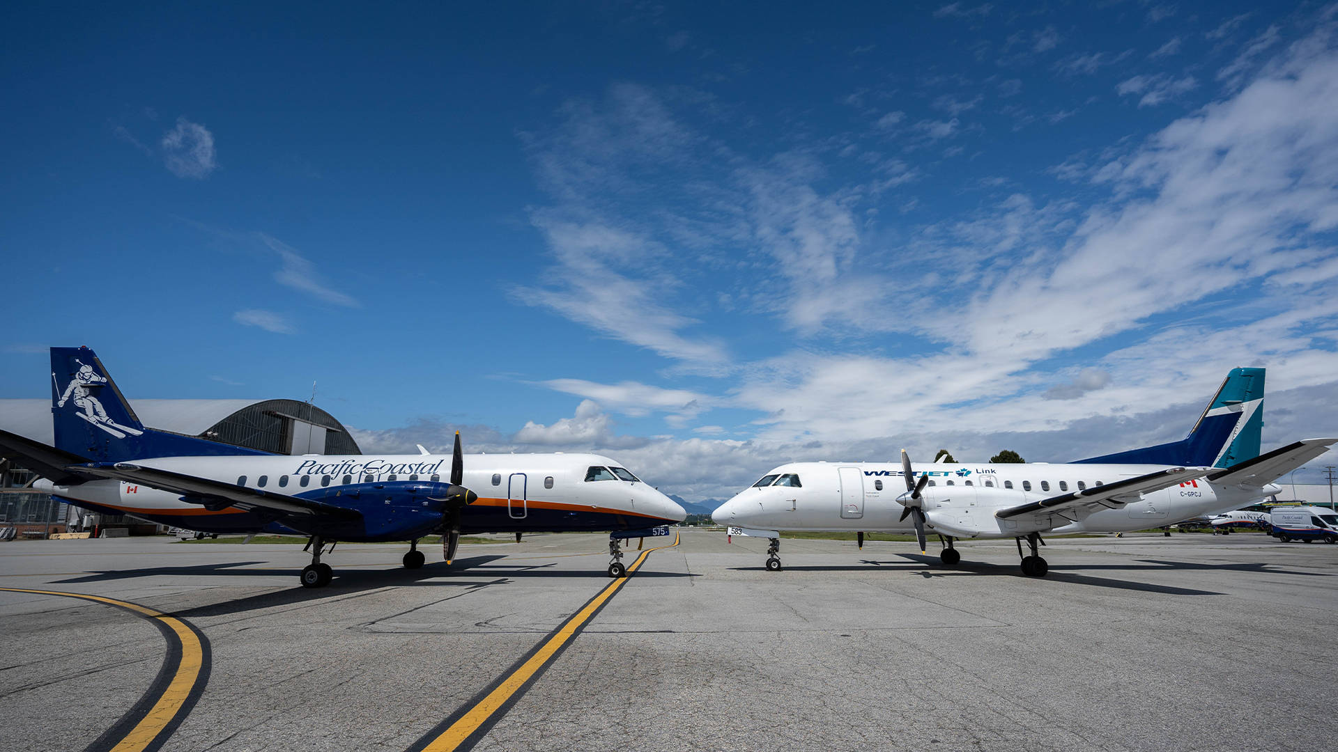 Westjet Airplane Facing Each Other Background