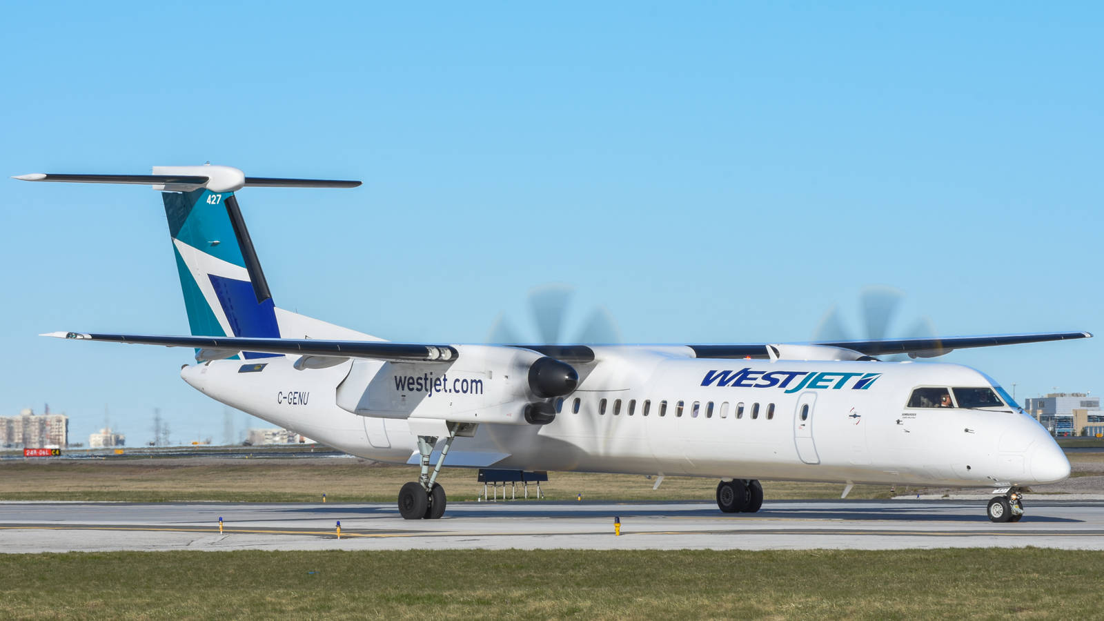 Westjet Airplane On Runway Background