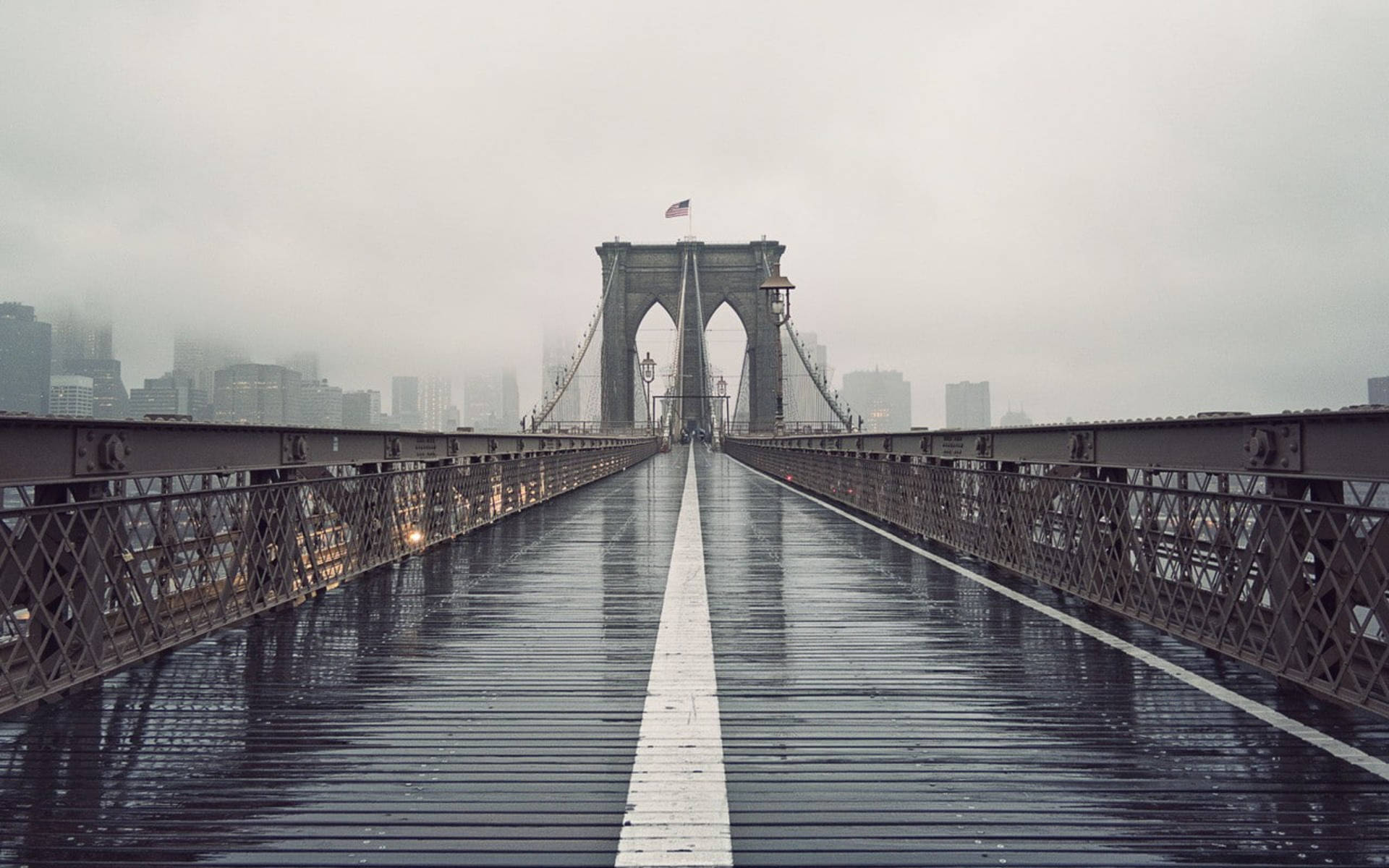 Wet Walkway On The Brooklyn Bridge Background