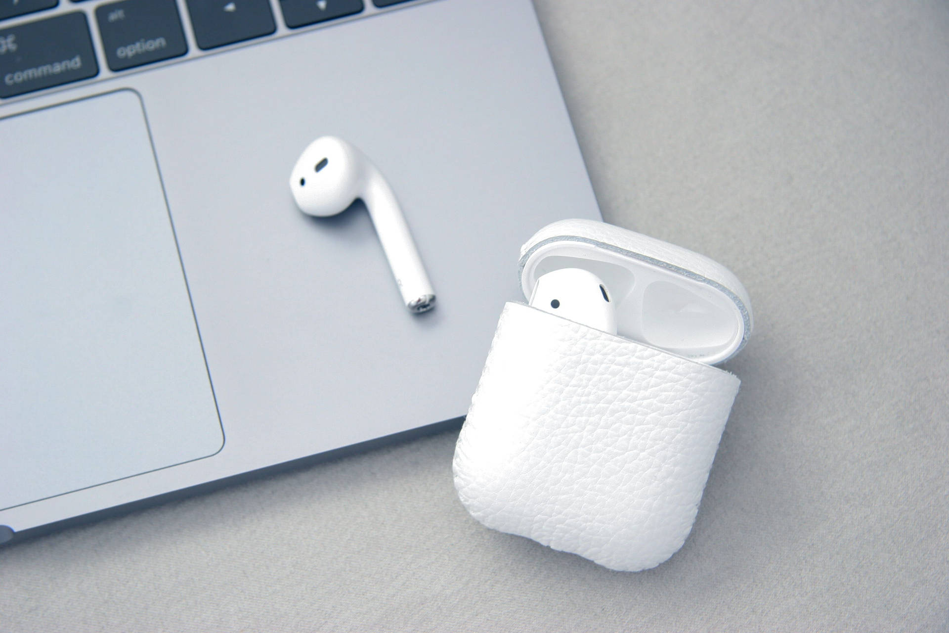 White Airpods And Macbook