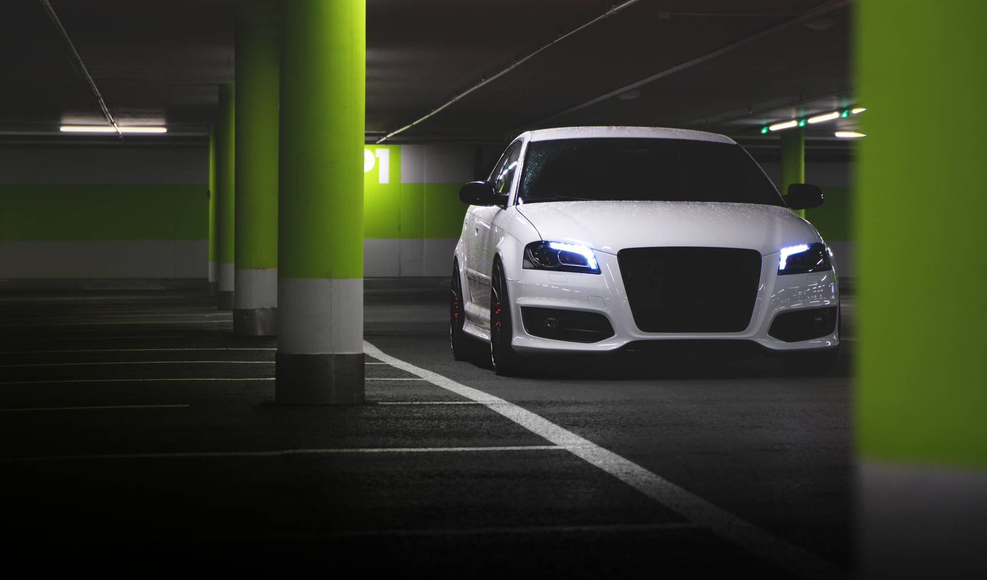 White Audi In Neon Parking Lot Background
