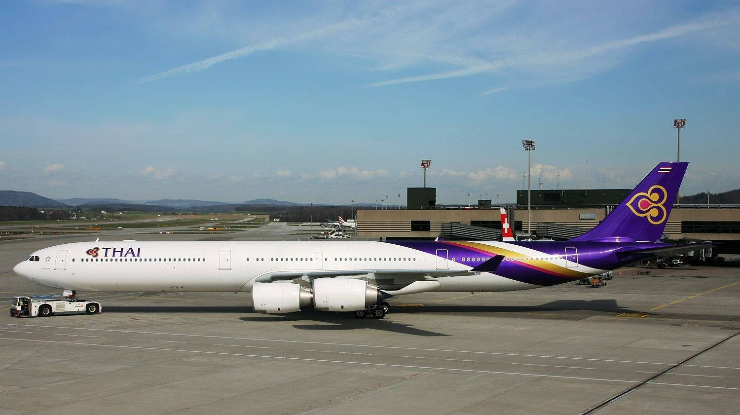 White Car Under Thai Airways Plane Background