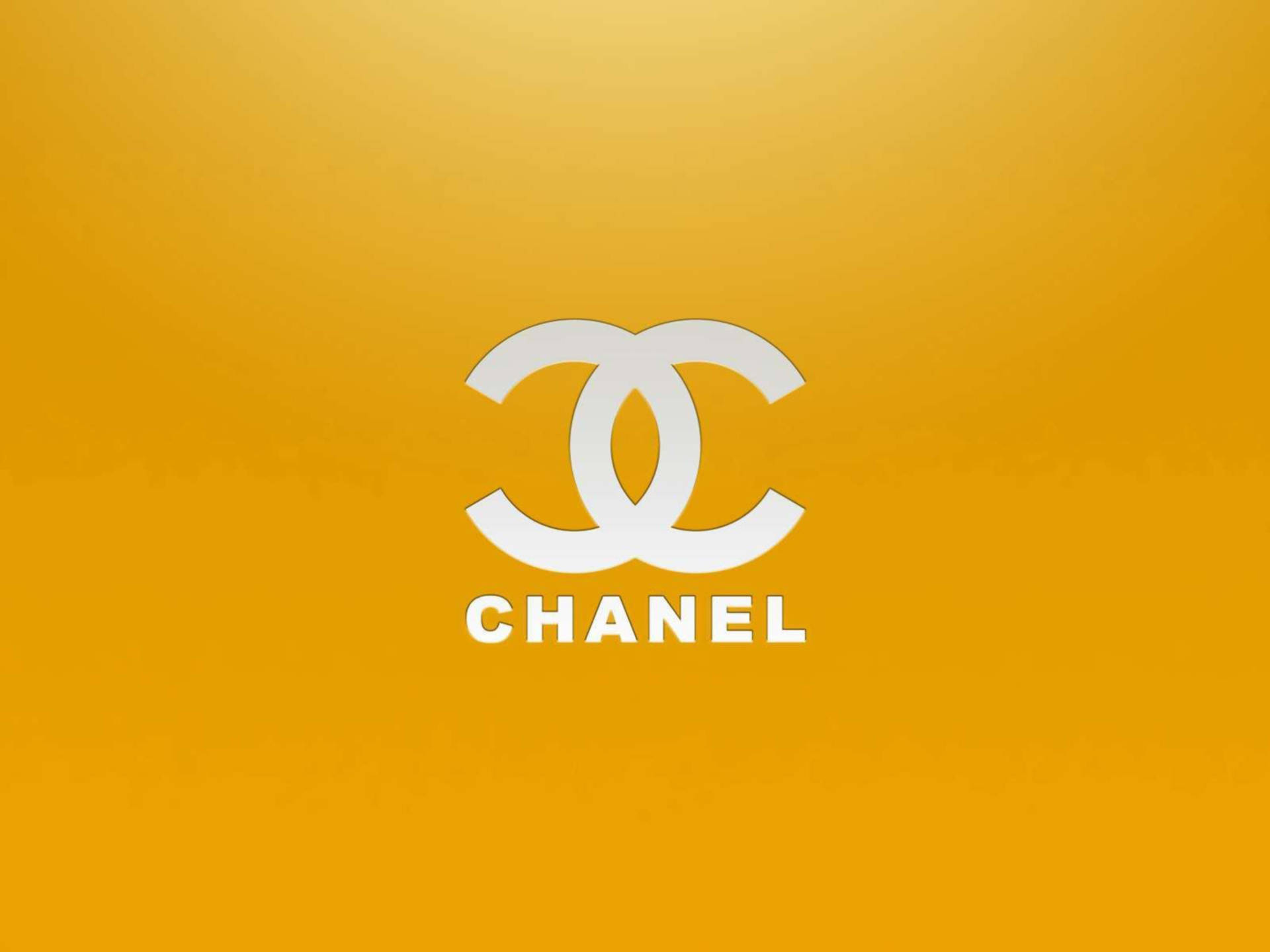 White Chanel Logo On Golden Yellow Background
