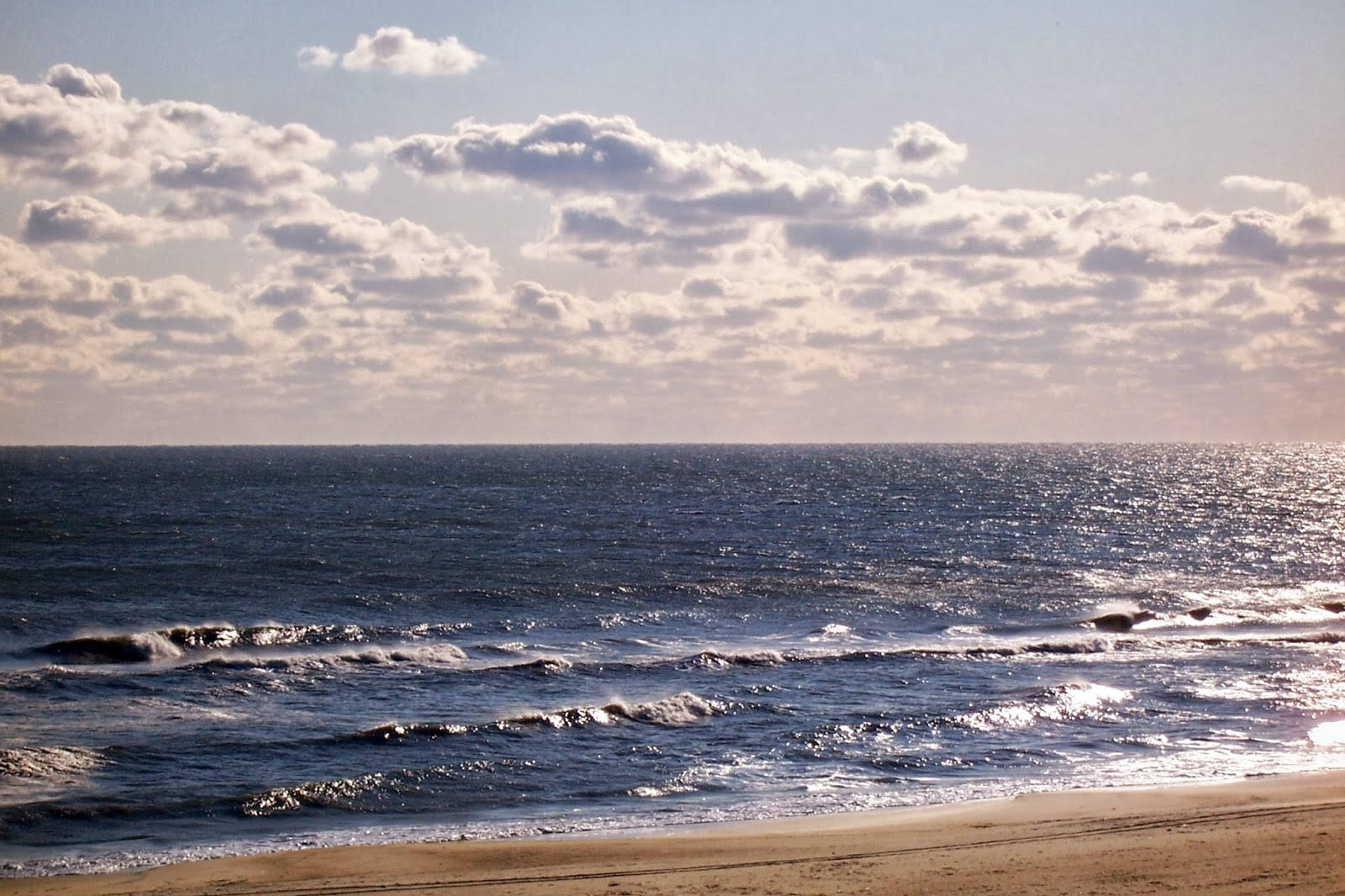 White Clouds Above Blue Virginia Beach Background