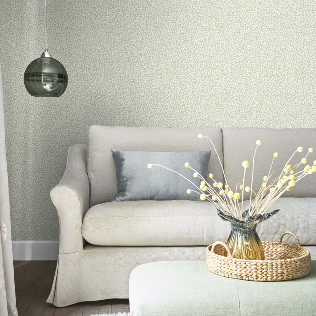 White Couch And Table Against A Wall With A Subtle Design Background