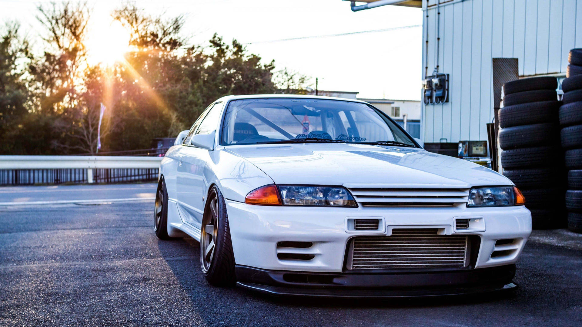 White Jdm Car With Sunset Rays Background