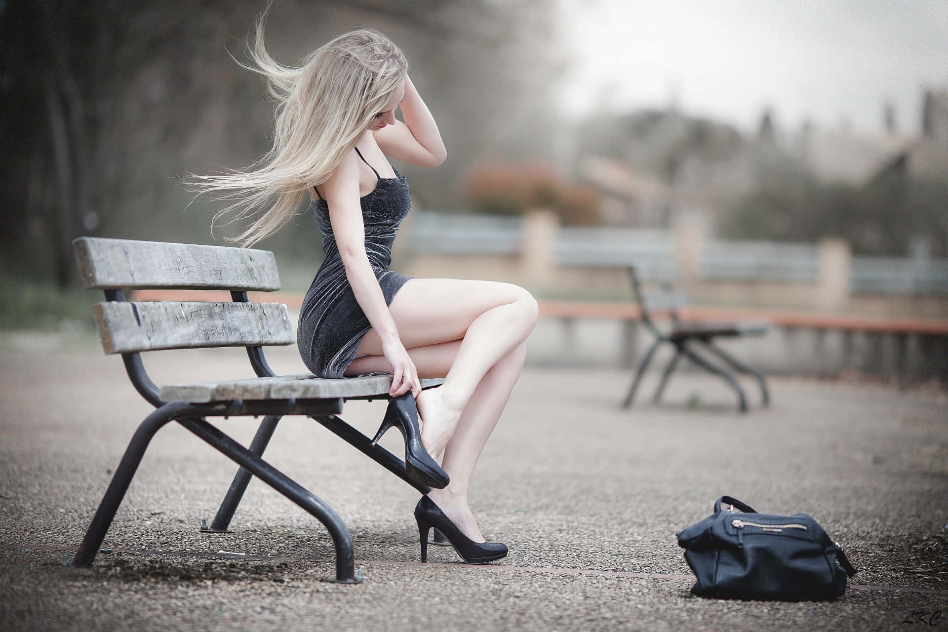 White Lady Sitting On A Bench Background