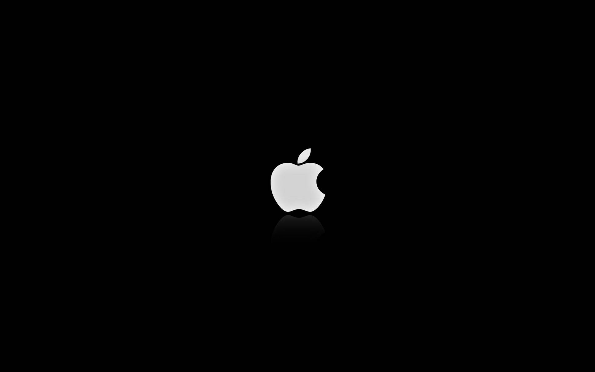 White Lit Apple Logo Dark Screen Background