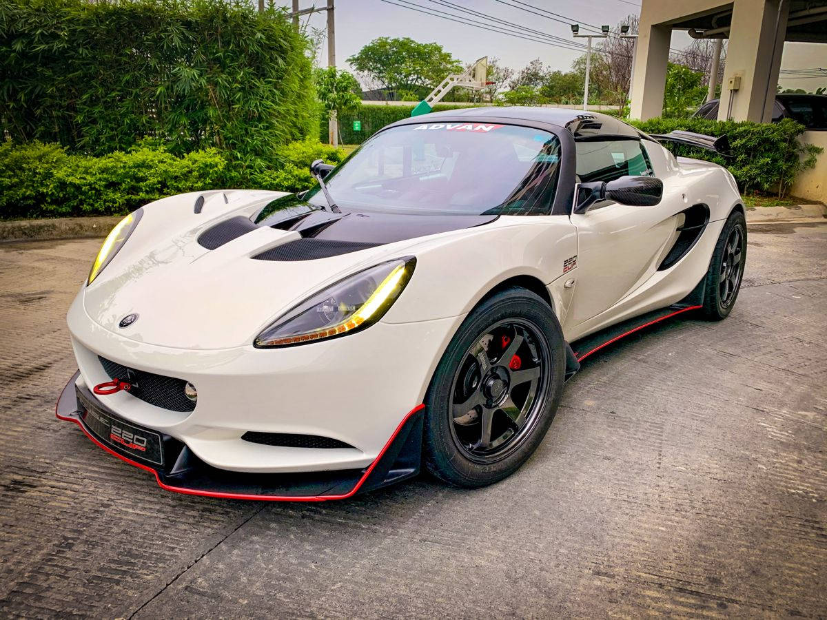 White Lotus Elise Sports Car Parked Background