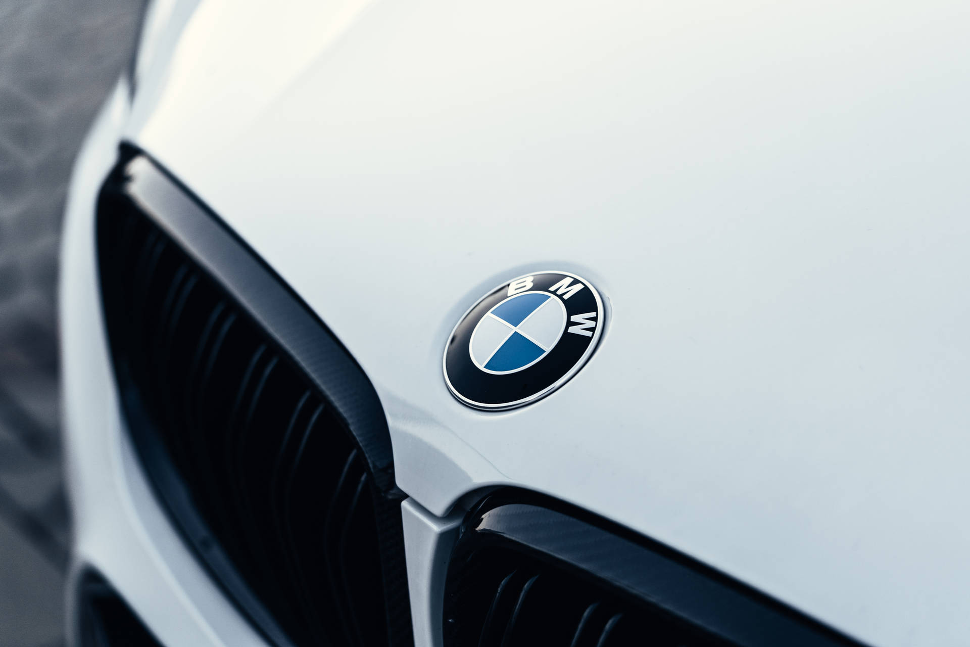 White Luxury Car Hood With Bmw Logo