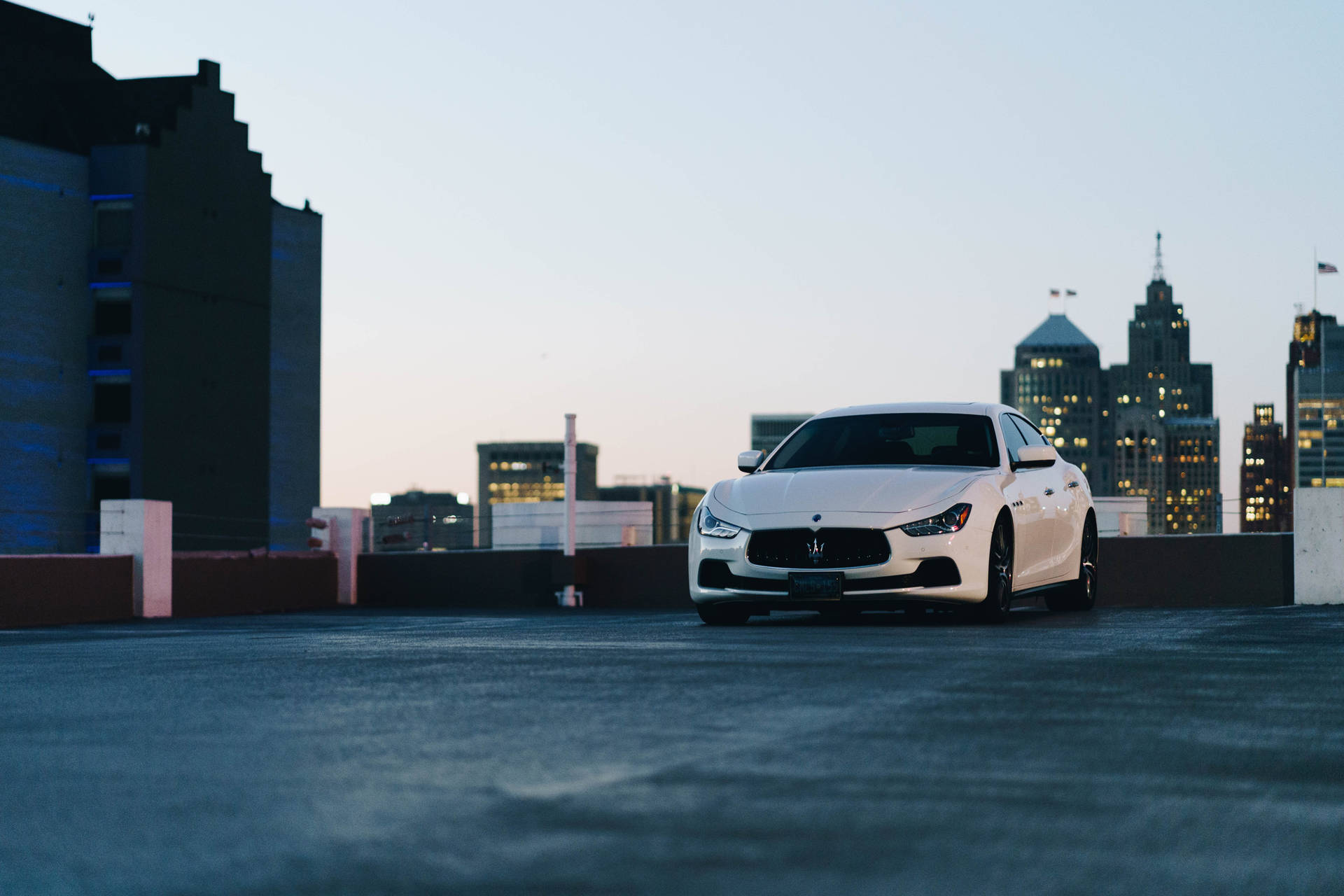 White Maserati And Cityscape Background
