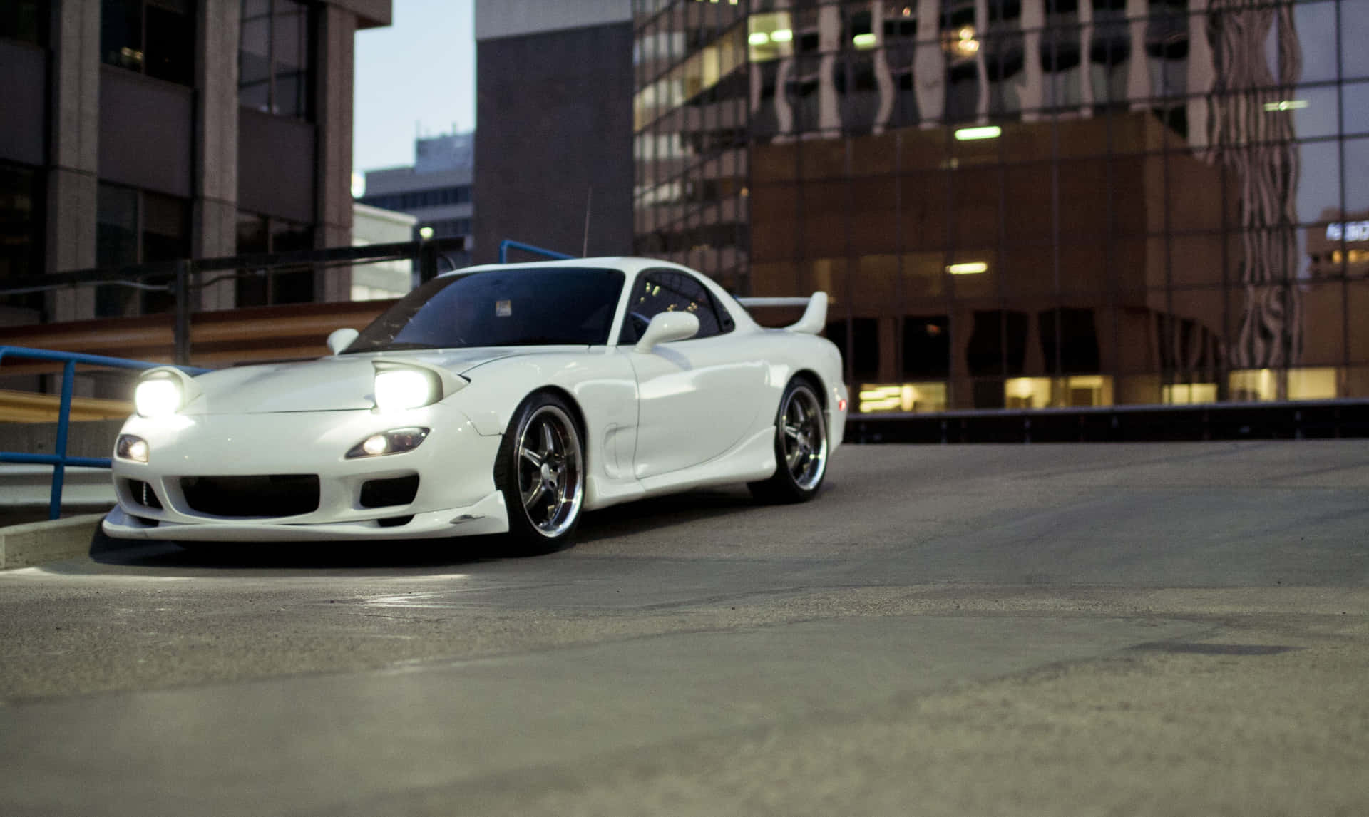 White Mazda Rx 7 In Front Of Building Background