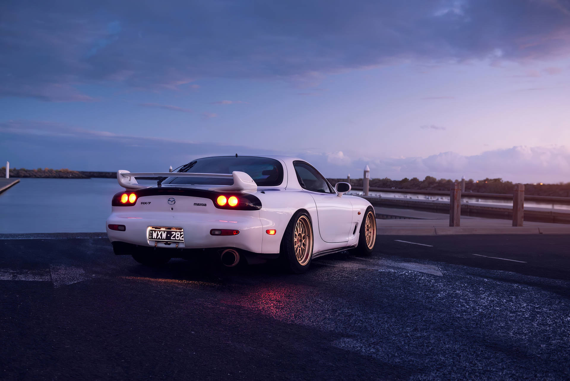 White Mazda Rx7 At Sunset Background