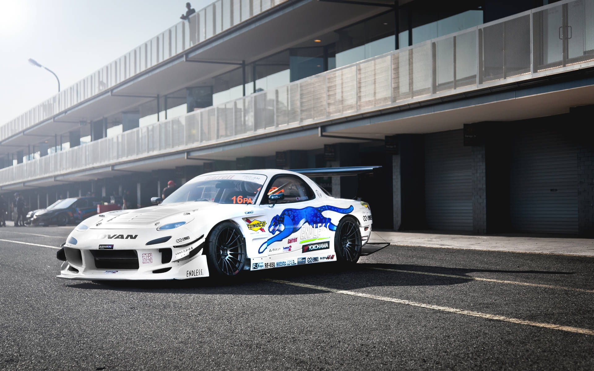 White Mazda Rx7 With Decals Background