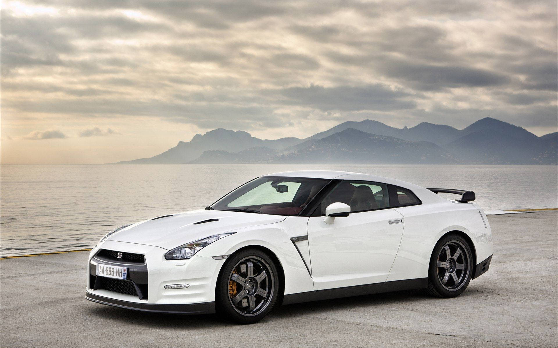 White Nissan Gtr Car Alongside A Seashore