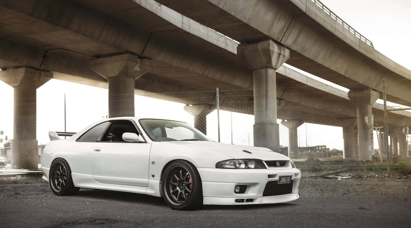 White Nissan R33 Gtr Under Bridge Background