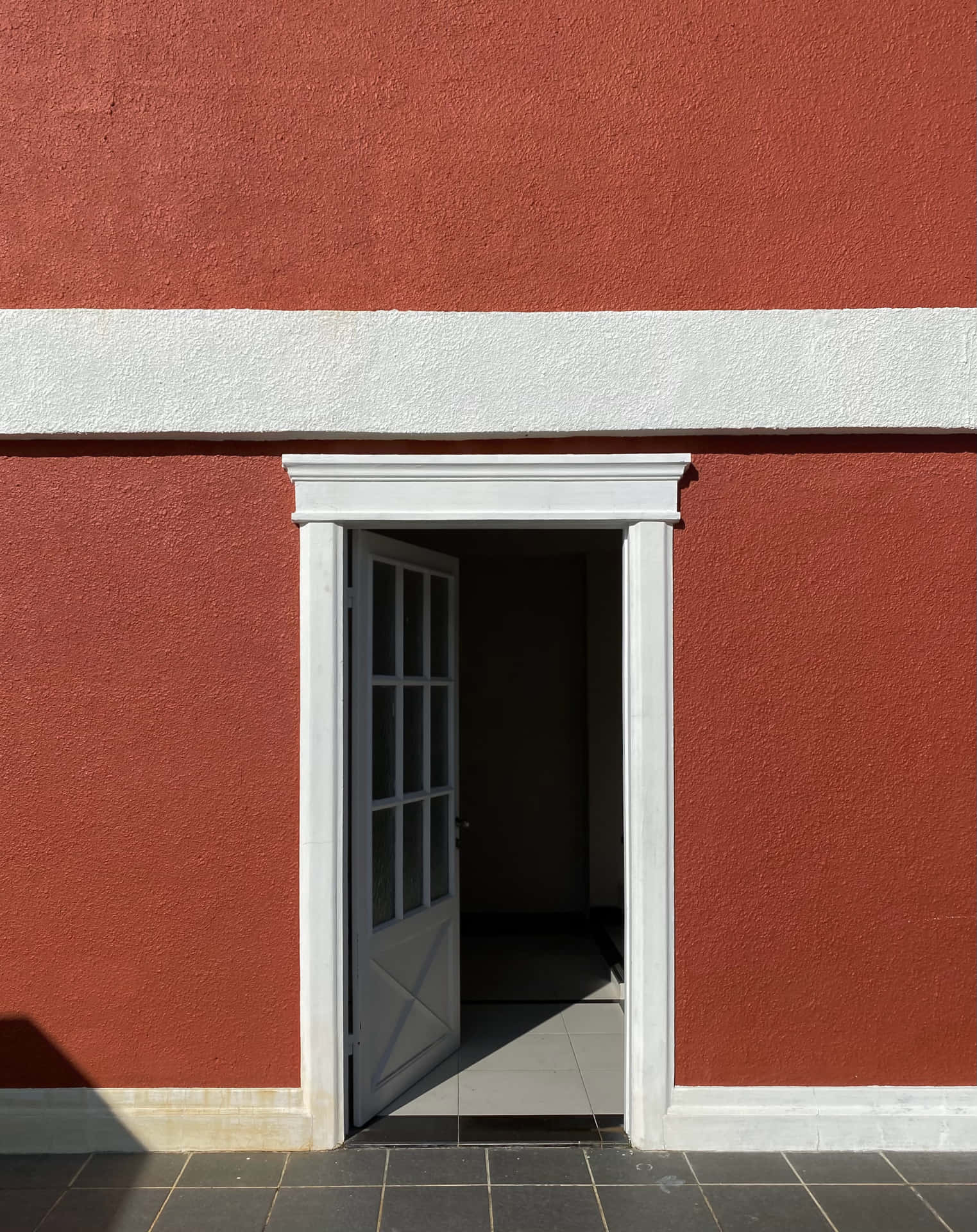 White Open Door Red Wall Background