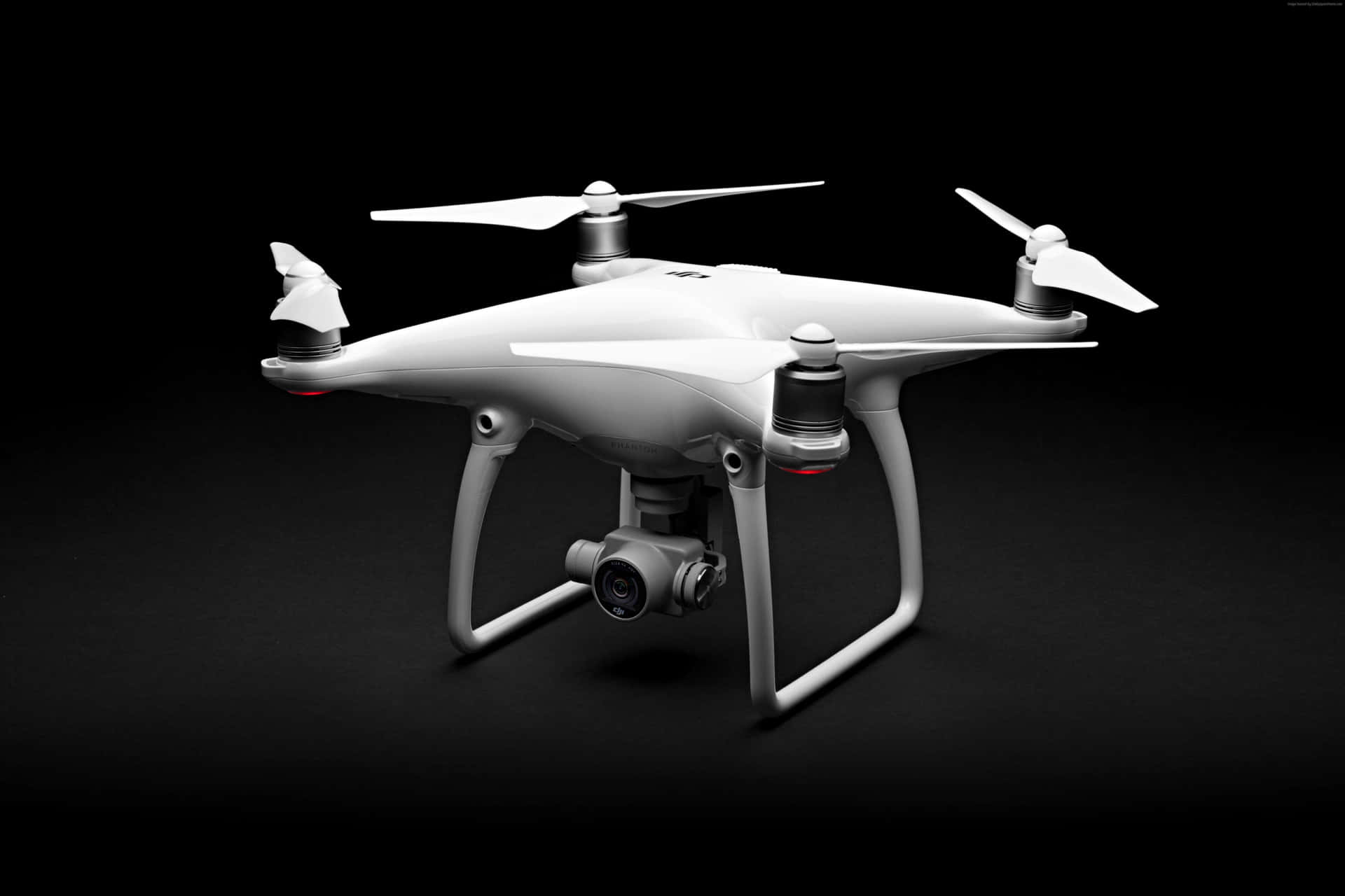 White Quadcopter Drone Black Background