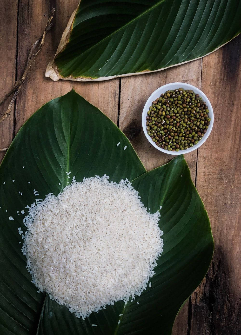 White Rice On A Fragrant Leaf And A Bowl Of Mung Beans