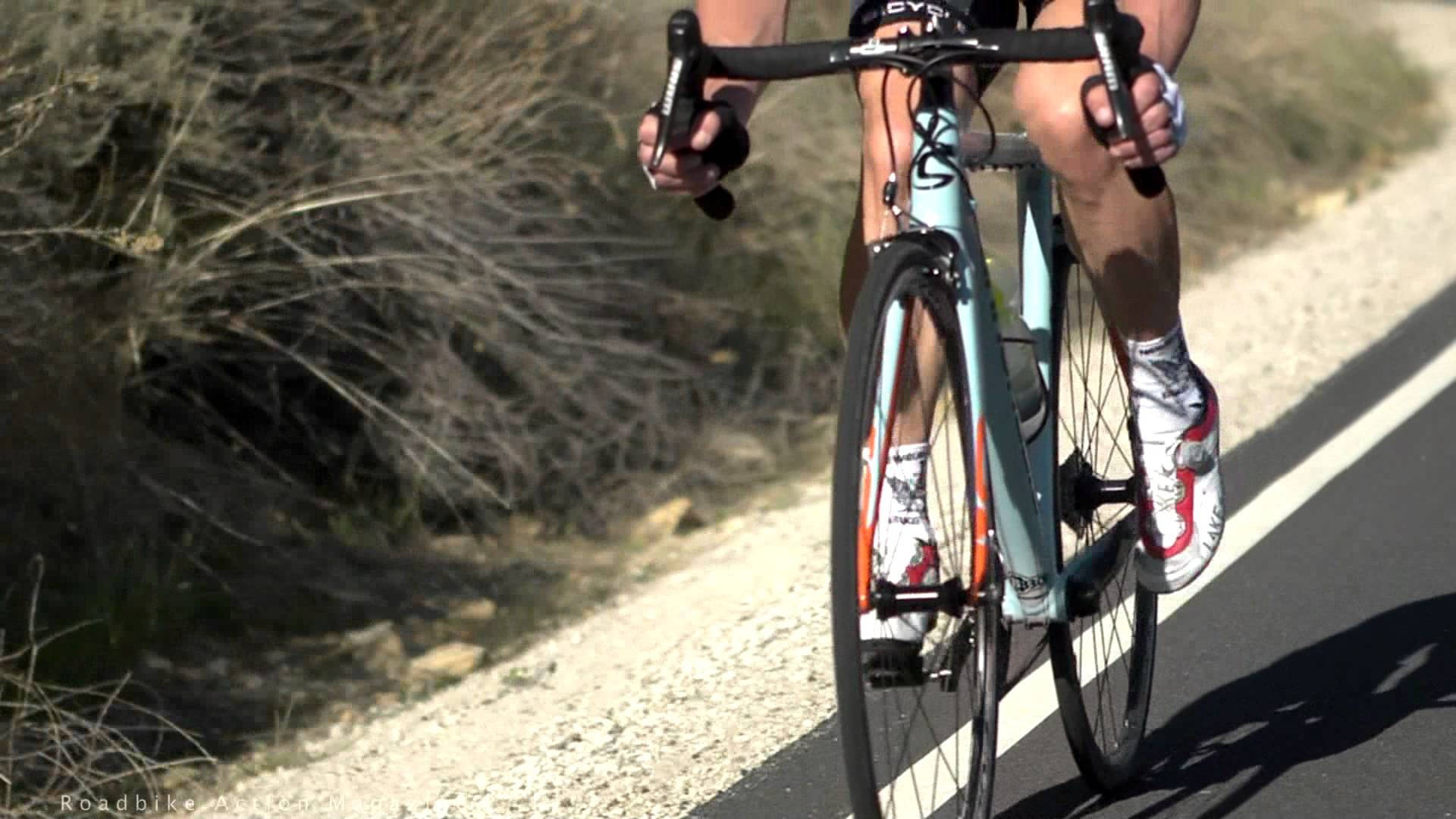 White Road Bike In Road Background