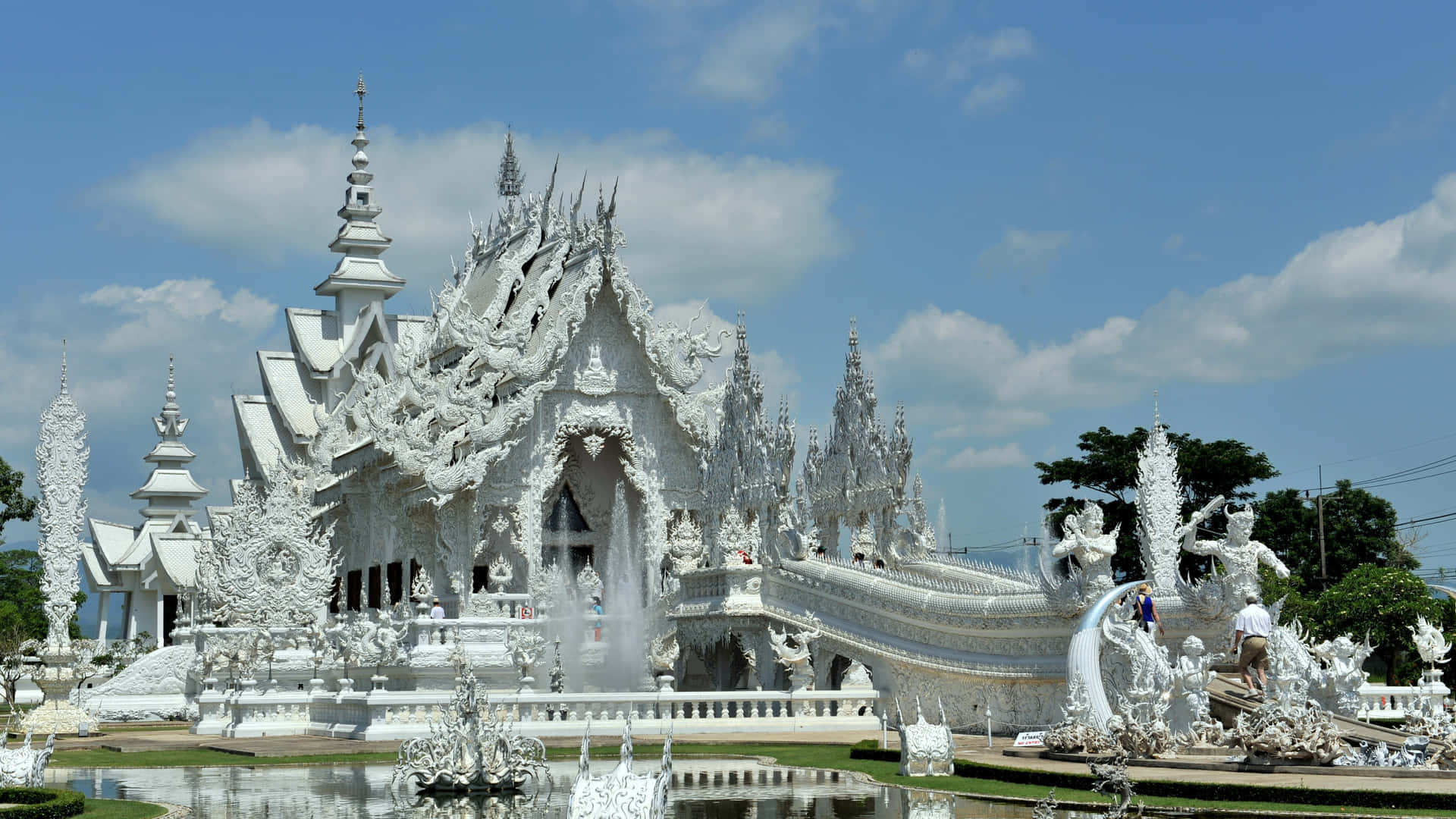 White Temple In Chiang Rai Agaianst A Beautiful Sky Background