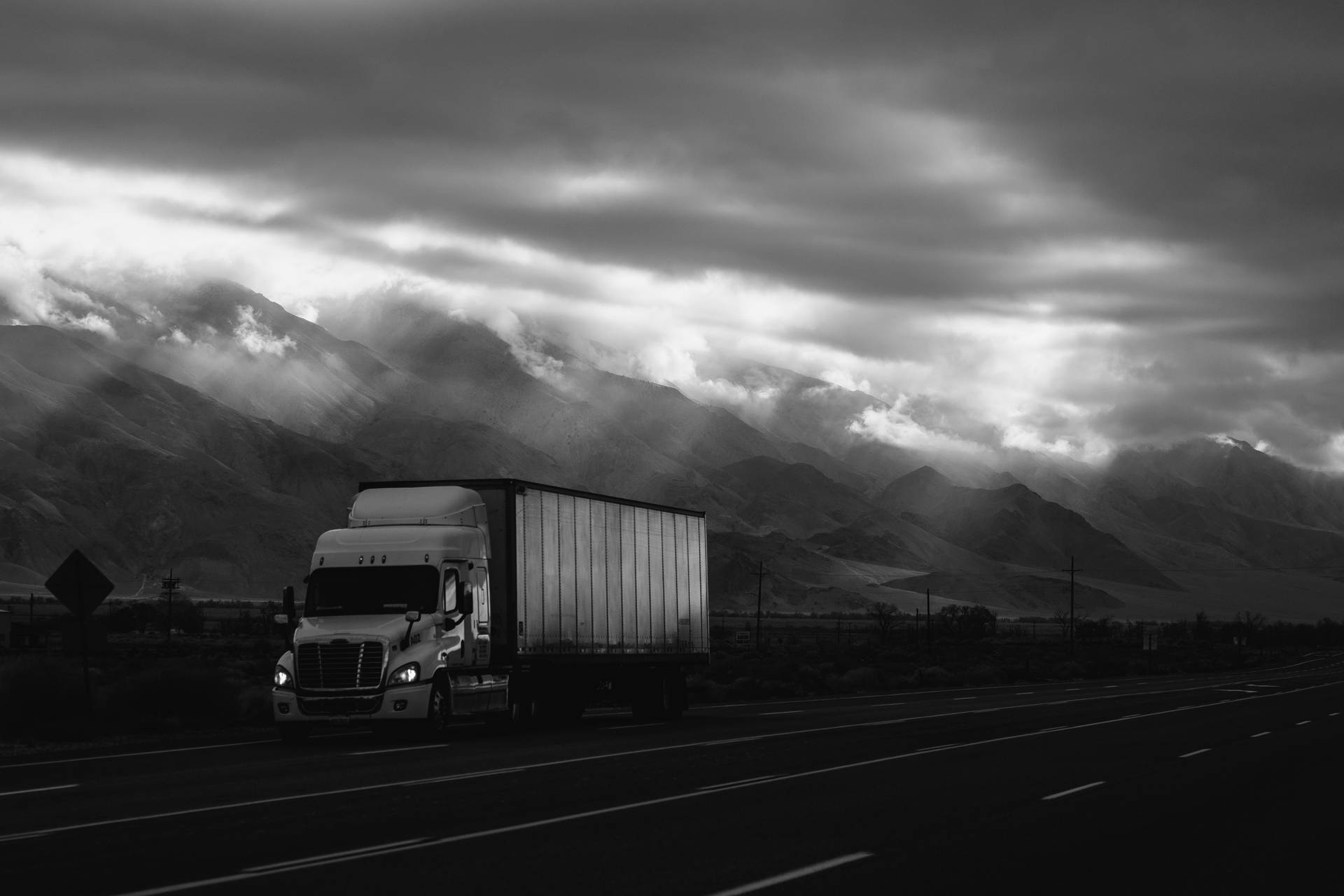 White Truck At Overcast Clouds Background
