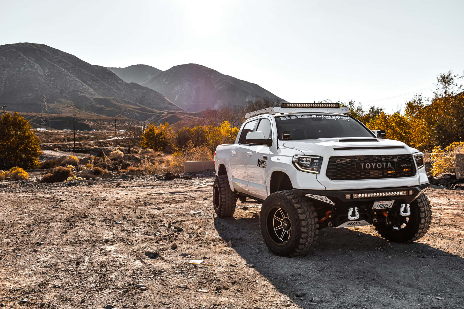 White Tundra With Large Tires Background