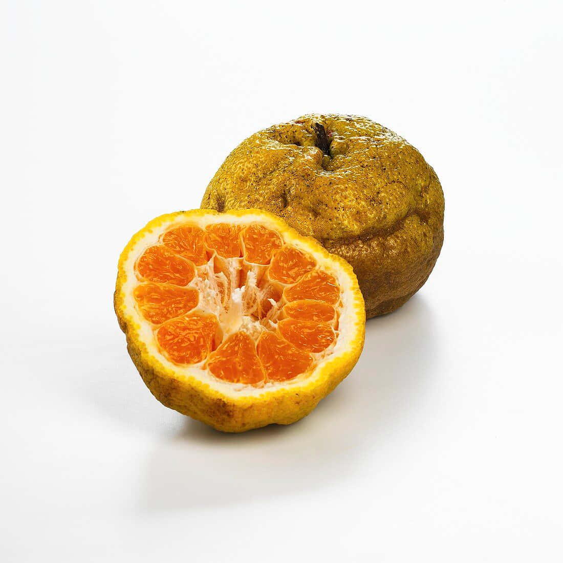 Whole And Slice Ugli Citrus Fruits Background