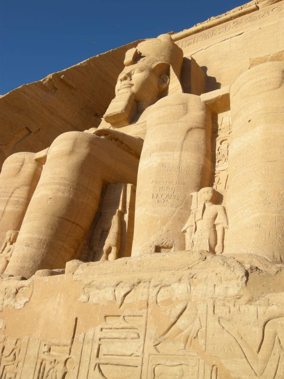 Whole-body Picture Of Ramses Ii The Great At Abu Simbel's Temple Background