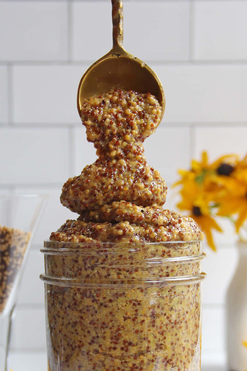 Whole Grain Mustard Overflowing Jar Background