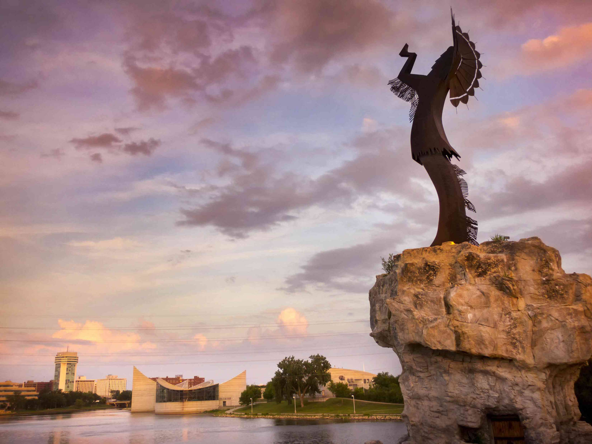 Wichita's Keeper Of The Plains During Sunset Background