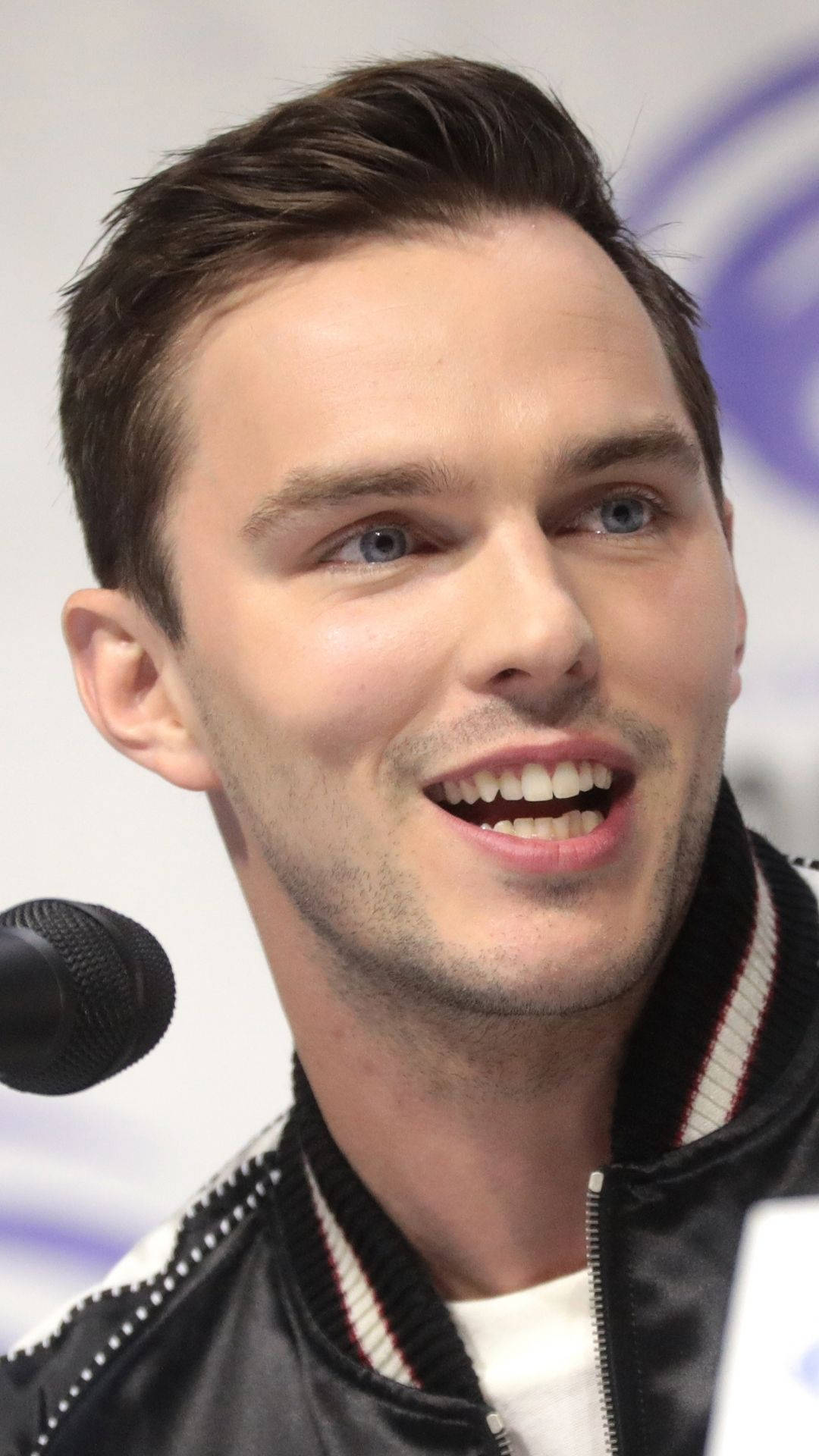 Wide Smile Of Nicholas Hoult Background