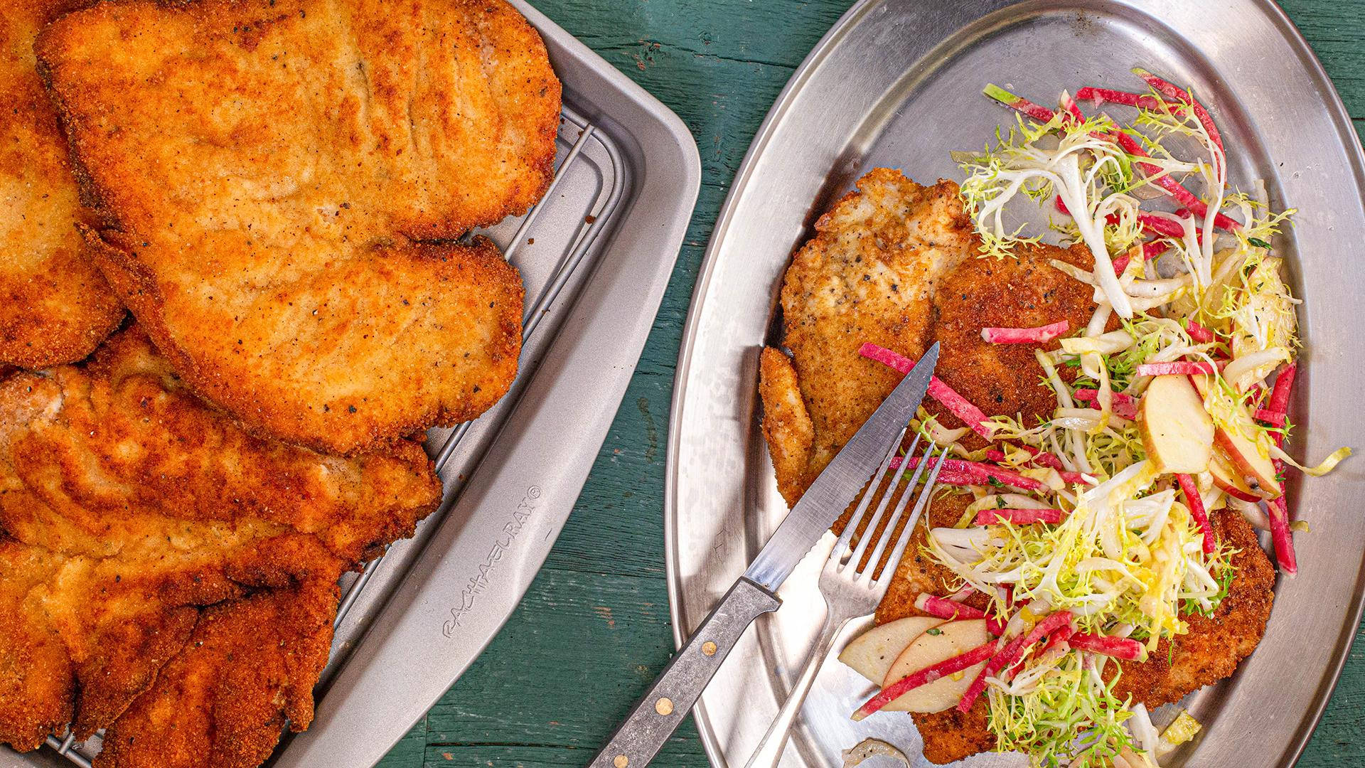 Wiener Schnitzel On Silver Platter Background