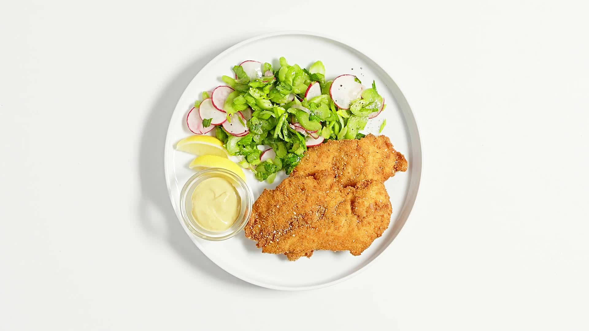 Wiener Schnitzel On White Platter Background