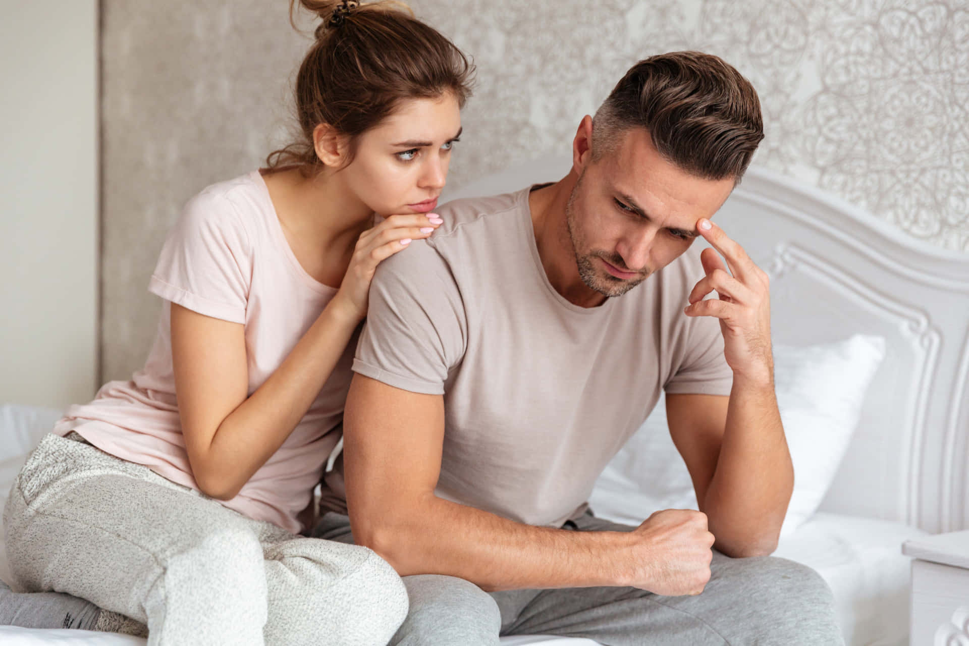 Wife Comforting Perturbed Husband Background