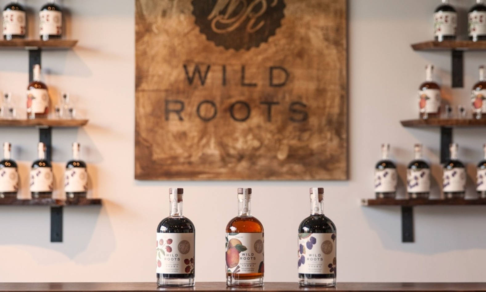 Wild Roots Logo And Vodka Background