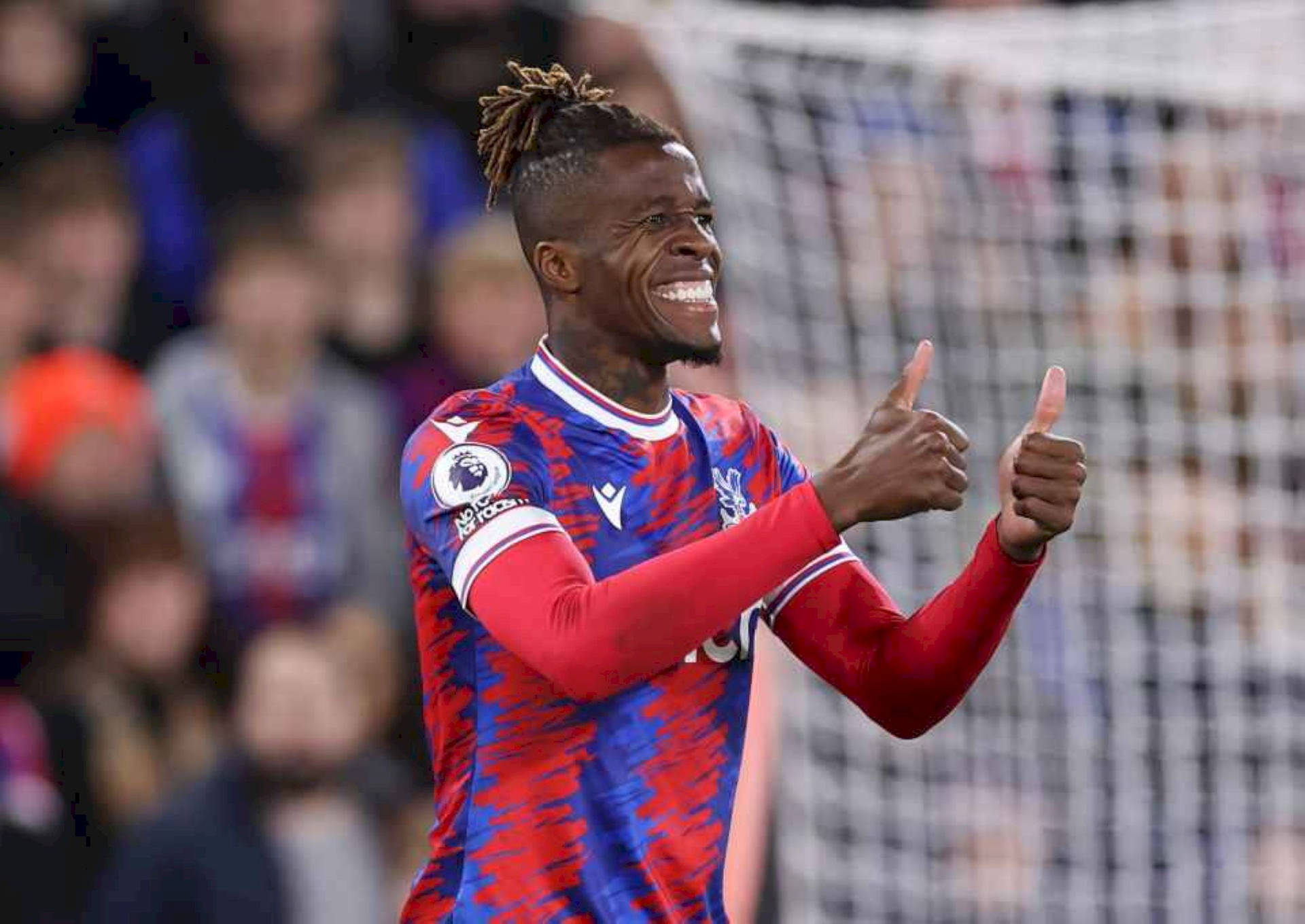 Wilfried Zaha Doing Thumbs Up Background