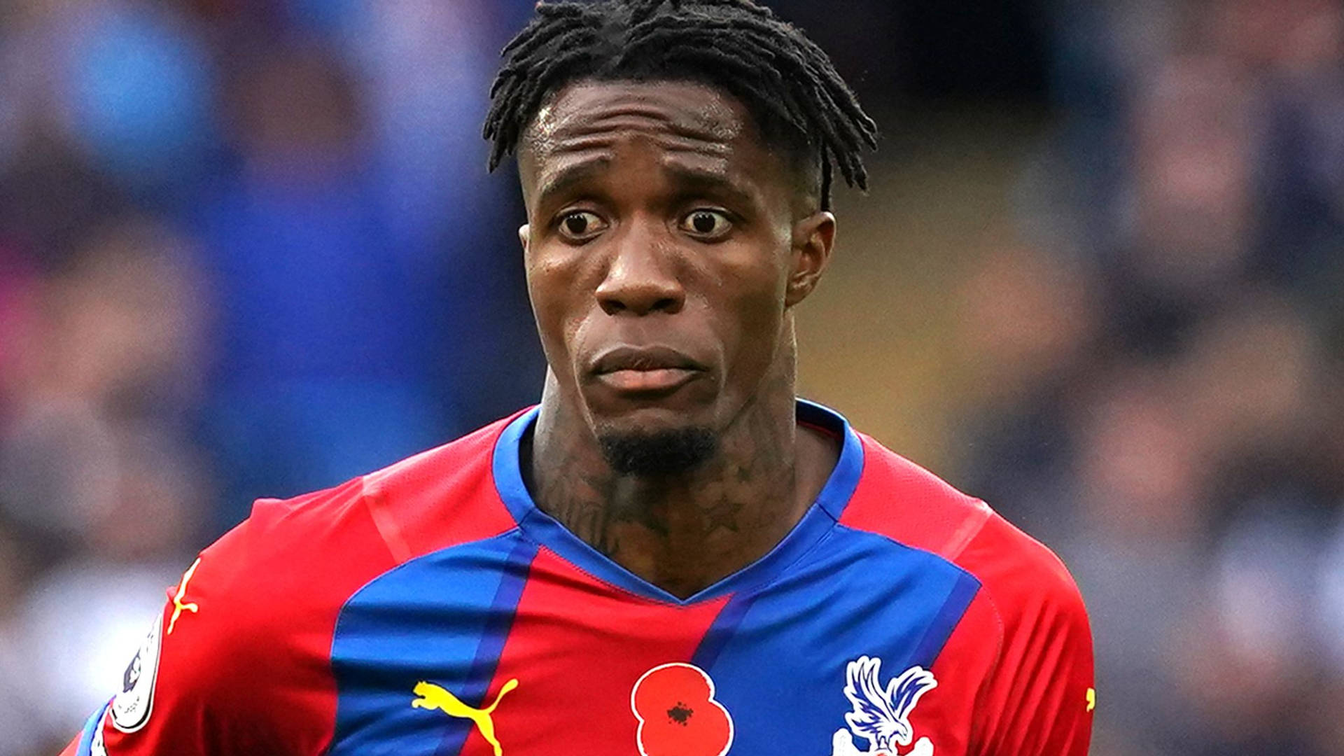 Wilfried Zaha Frowning Background