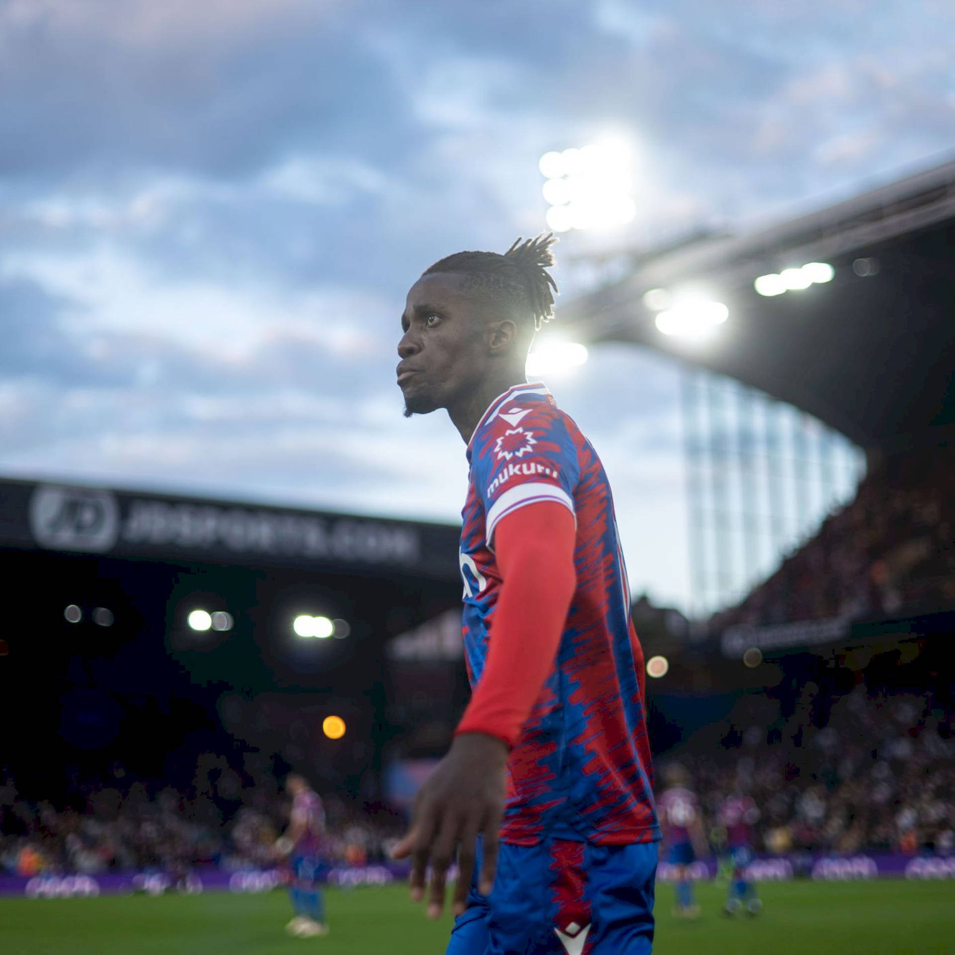 Wilfried Zaha In Football Stadium Background