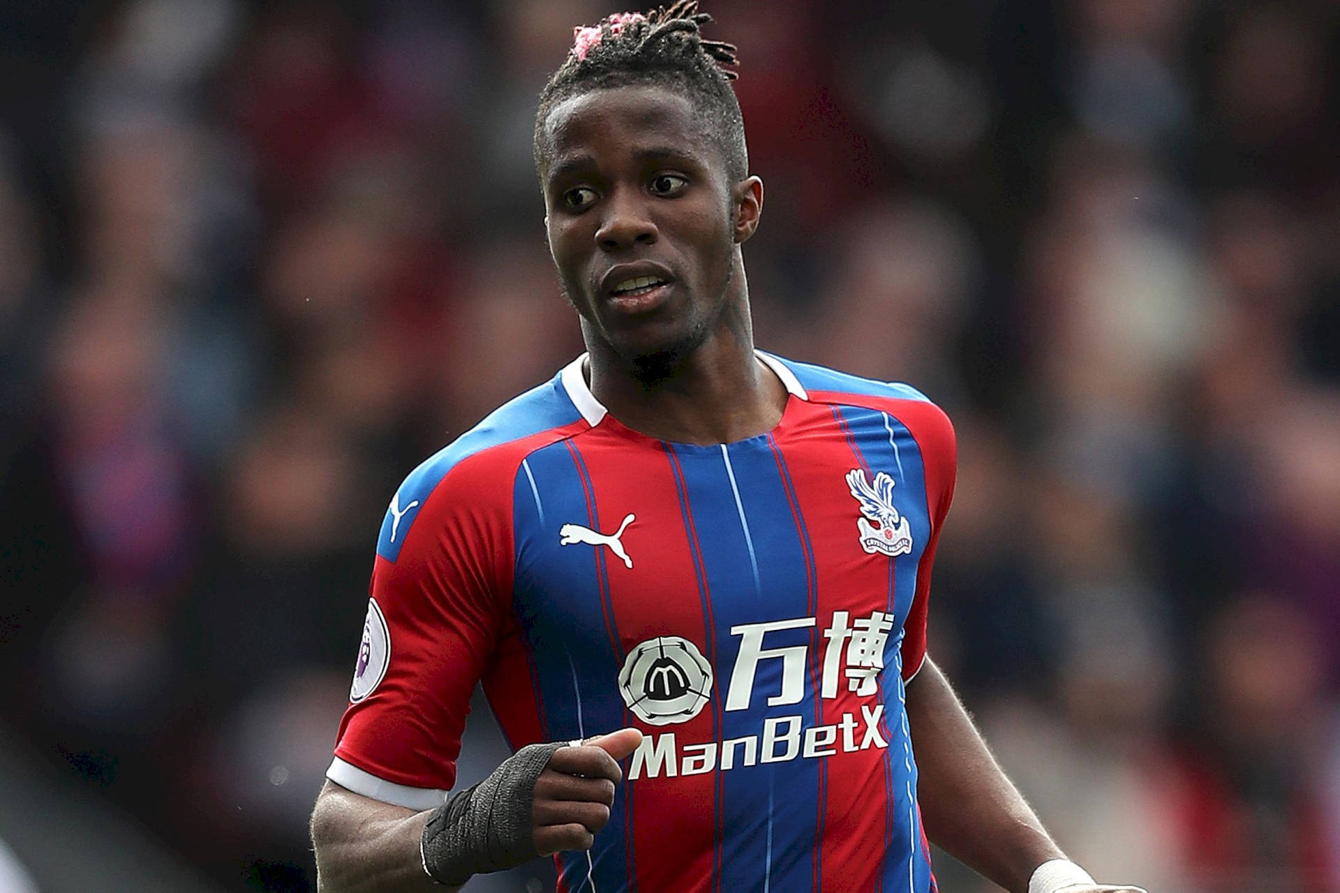 Wilfried Zaha In Striped Jersey Background